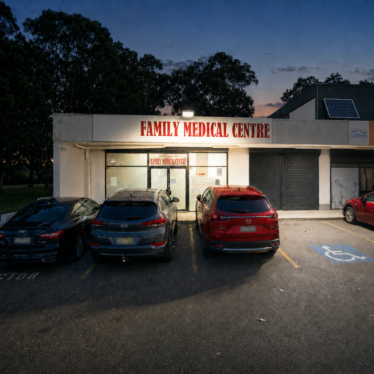 100W solar flood lamp with roof-mounted panel over a commercial depot entry. Weatherproof solar lights floodlights for Australian business premises.