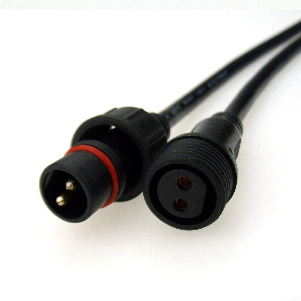 A pair of heavy-duty 2-pin twist-lock plugs designed for linking power cords on a solar security light system.