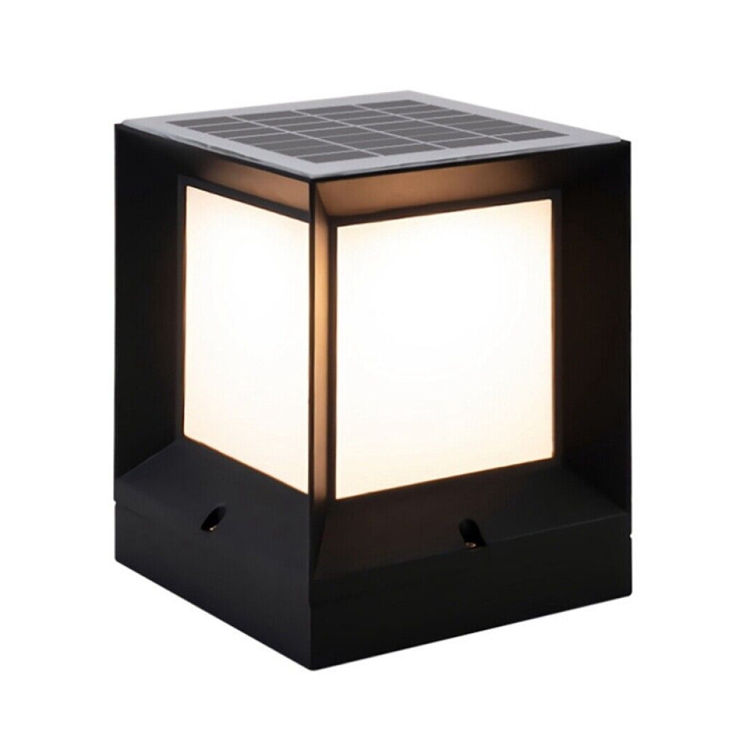 Square solar pillar light with illuminated frosted panels and a sleek black frame, topped with an integrated solar panel. Designed for modern outdoor settings—ideal for gates, patios, or garden pillars with energy-saving dusk-to-dawn lighting.