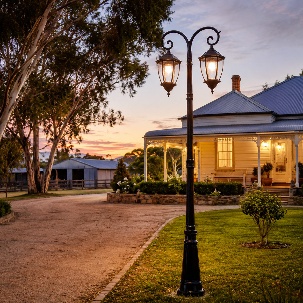 Antique black Double Head solar Post Light illuminating a rural driveway and front garden entry of a classic Federation-style home at dusk.