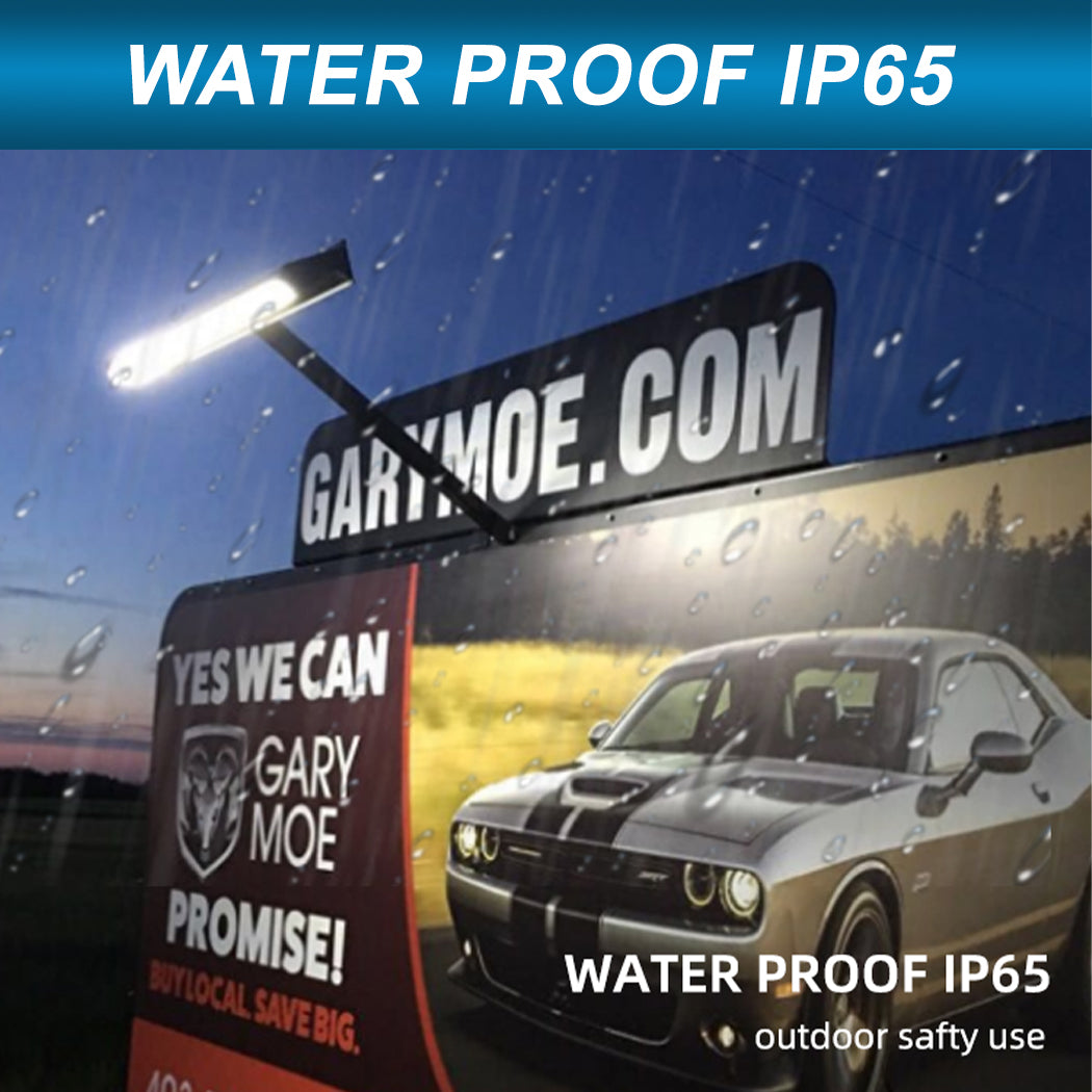 Outdoor billboard illuminated by a solar-powered LED light fixture mounted above the display. The light operates in rainy conditions, showcasing its IP65 waterproof rating and durability for all-weather use. Ideal for commercial signage, the setup ensures consistent nighttime visibility while promoting energy efficiency and local advertising.