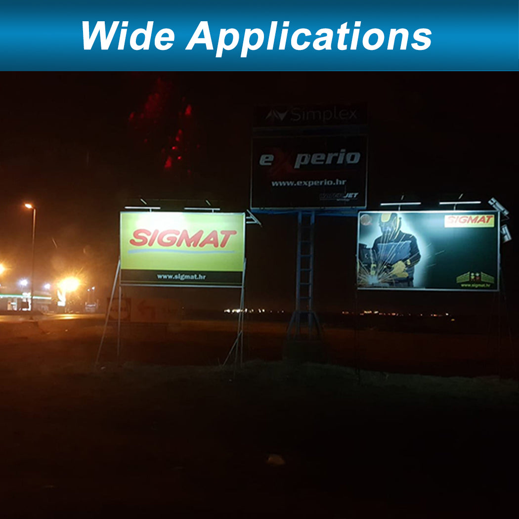 Nighttime roadside view of three illuminated billboards, each lit by solar-powered LED fixtures mounted above. The lights provide consistent, energy-efficient illumination across varied signage, demonstrating wide application for commercial advertising. The setup highlights the versatility and effectiveness of solar lighting in outdoor promotional environments