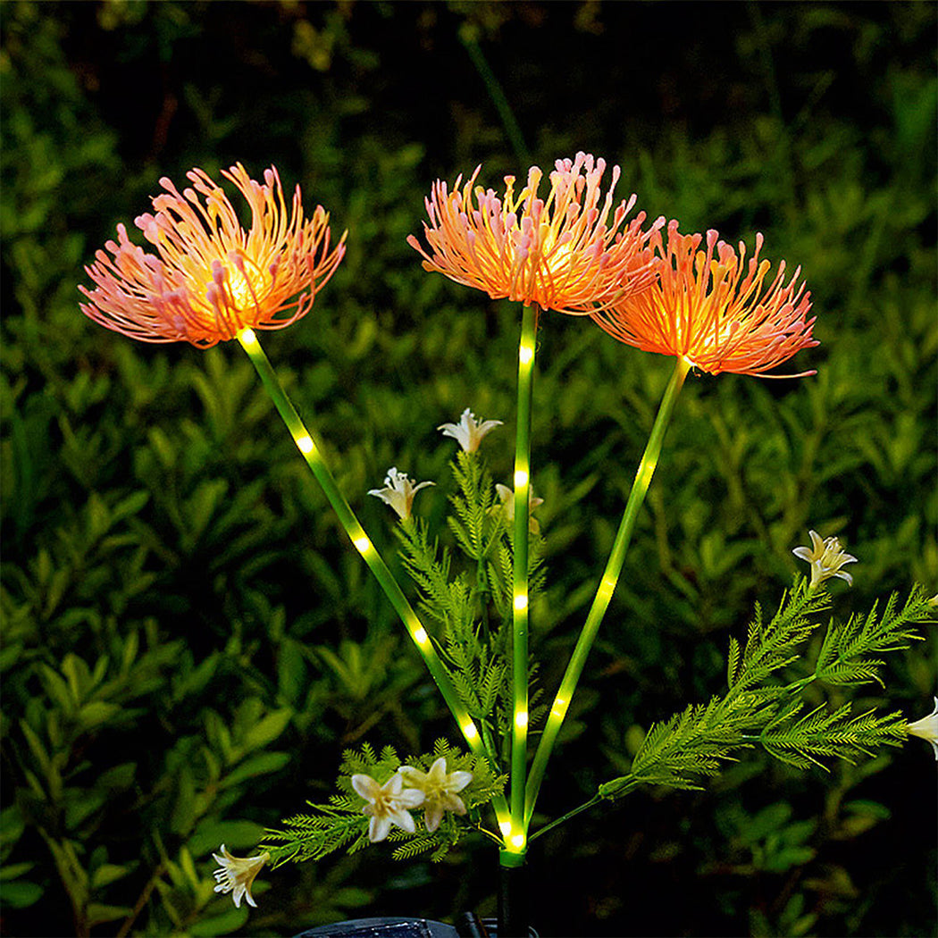 Solar-powered decorative light designed to resemble a vivid red spider lily, with delicate, elongated petals and glowing LED tips—ideal for adding striking color and elegance to garden landscapes