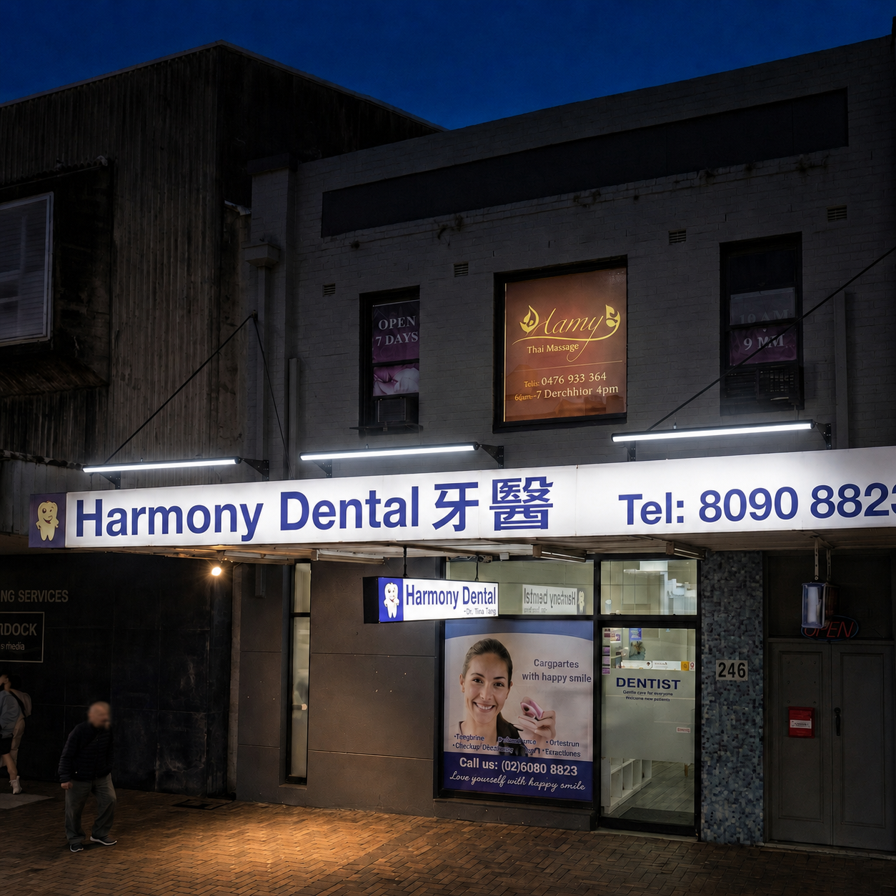 Three 120cm solar powered sign light units are mounted side-by-side to provide continuous night illumination for a wide commercial dental shopfront sign.