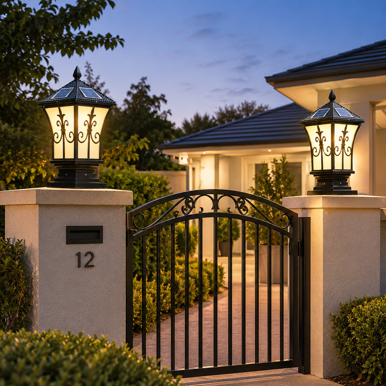 A pair of black decorative heritage solar lights mounted on concrete fence posts on either side of a front entrance metal gate, highlighting a premium solar gate light australia setup at dusk.