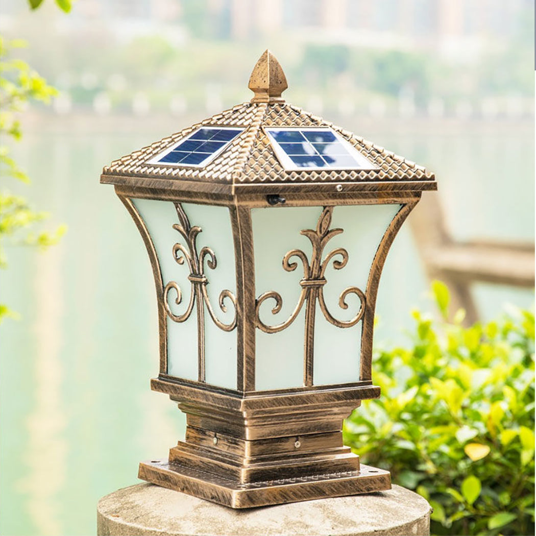 Heritage solar coach lamp and pillar post light on a concrete garden gate pillar in Australia.