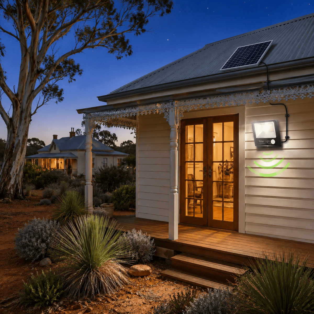 PIR solar security light illuminating a home verandah entryway at night with a roof-mounted split solar sensor flood light panel.