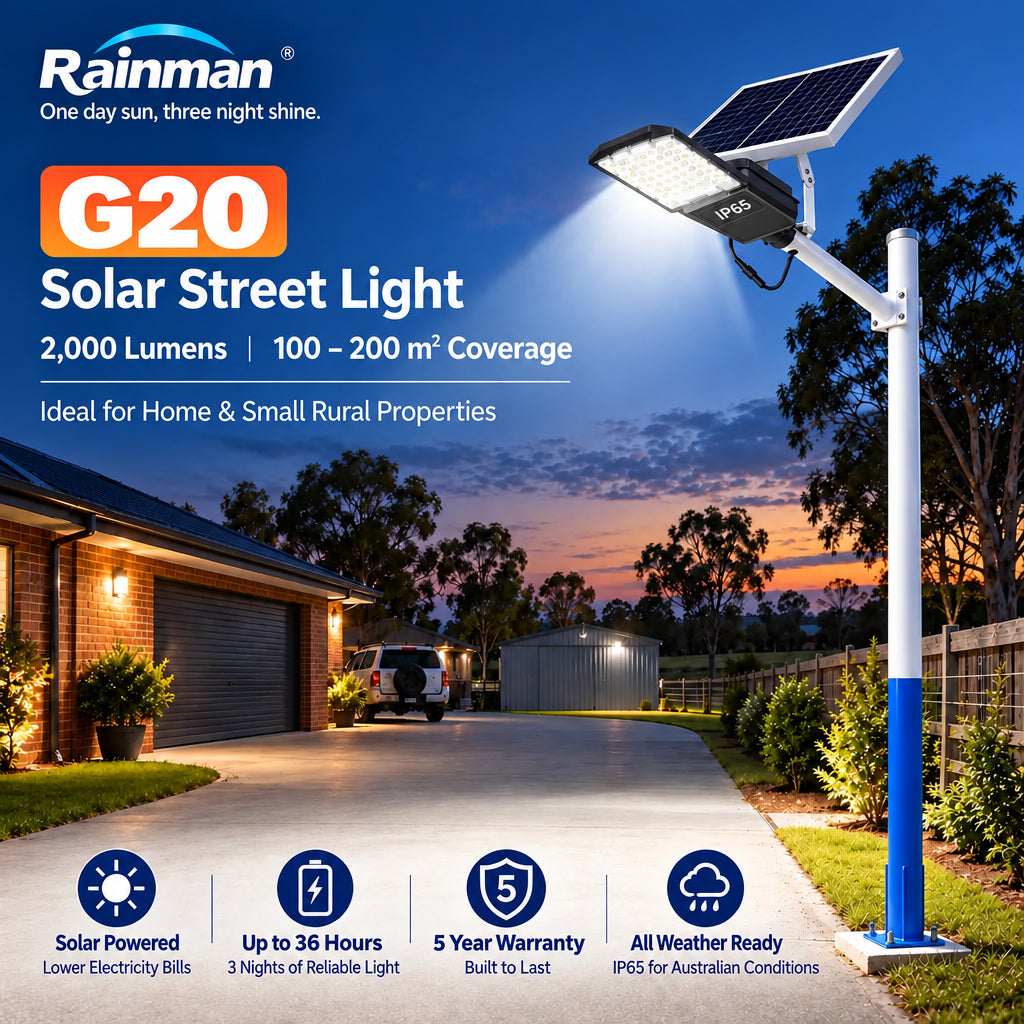 Rainman G20 2000 lumens solar street light illuminated at night on a post next to an Australian residential driveway and rural property shed.