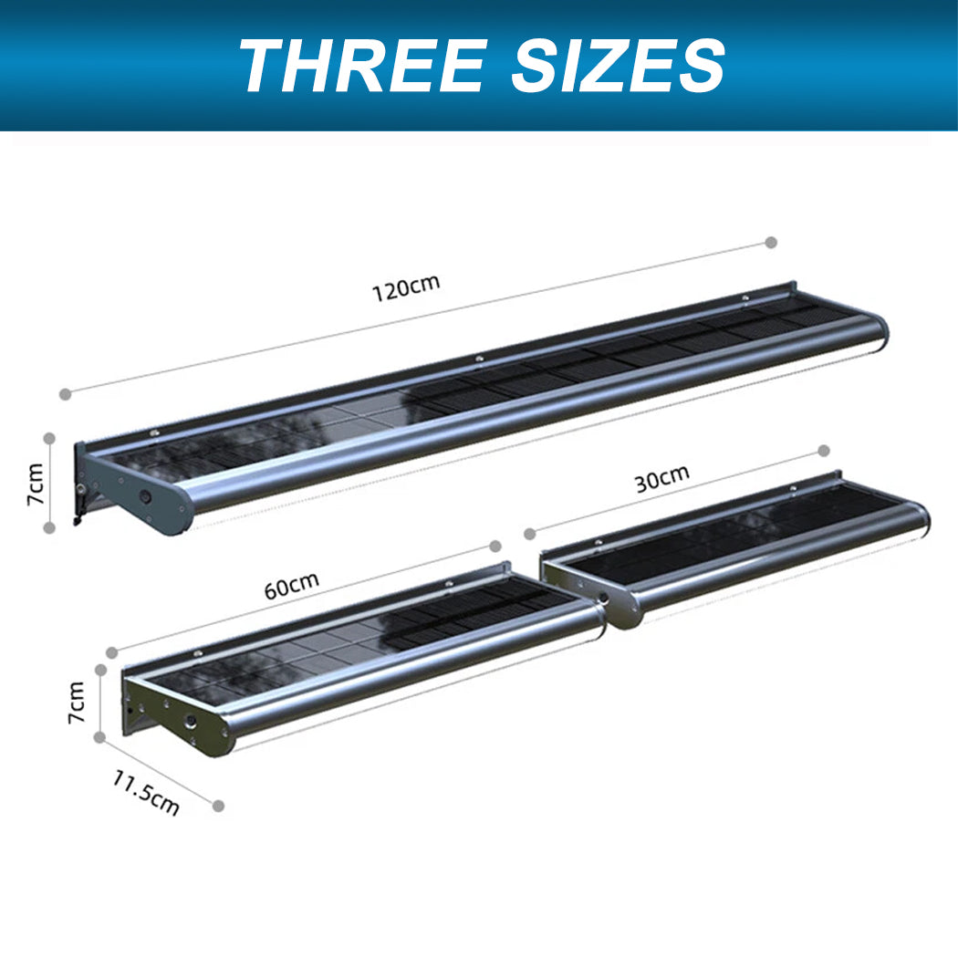 Three sizes of wall-mounted solar-powered LED lights designed for real estate billboard illumination. The fixtures feature sleek aluminum frames with integrated solar panels and are available in 30 cm, 60 cm, and 120 cm lengths. Ideal for outdoor signage, each unit offers energy-efficient lighting with a modern, weather-resistant design suitable for property advertising