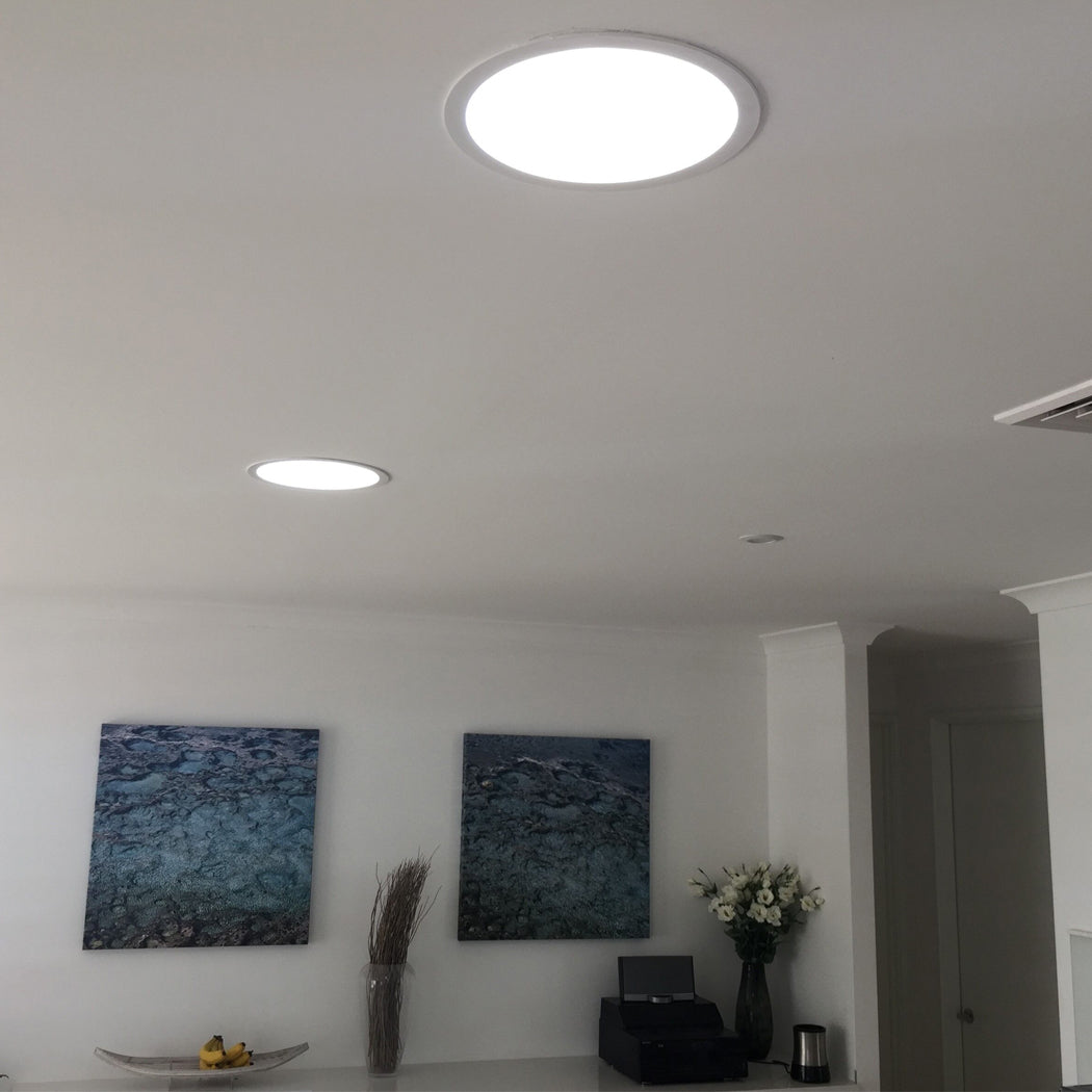 Installed round solar skylight in modern interior—provides bright, natural-style lighting with energy-efficient design and seamless ceiling integration