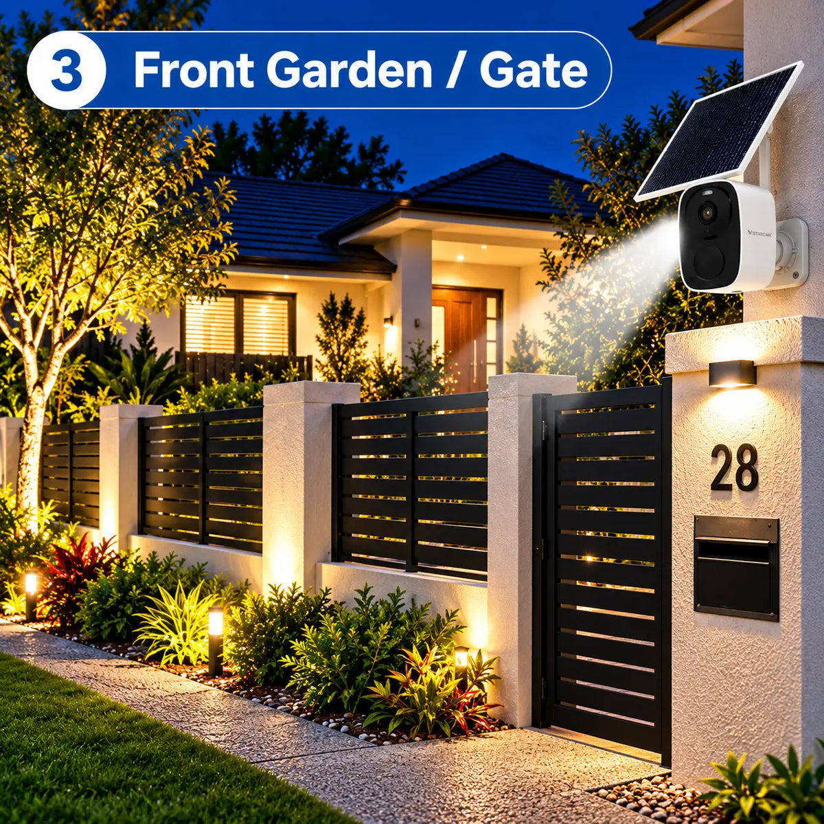 A Vstarcam BG55 solar powered security camera mounted on a modern concrete boundary wall, casting a bright security spotlight beam down onto a front garden gate and letterbox entrance at twilight.