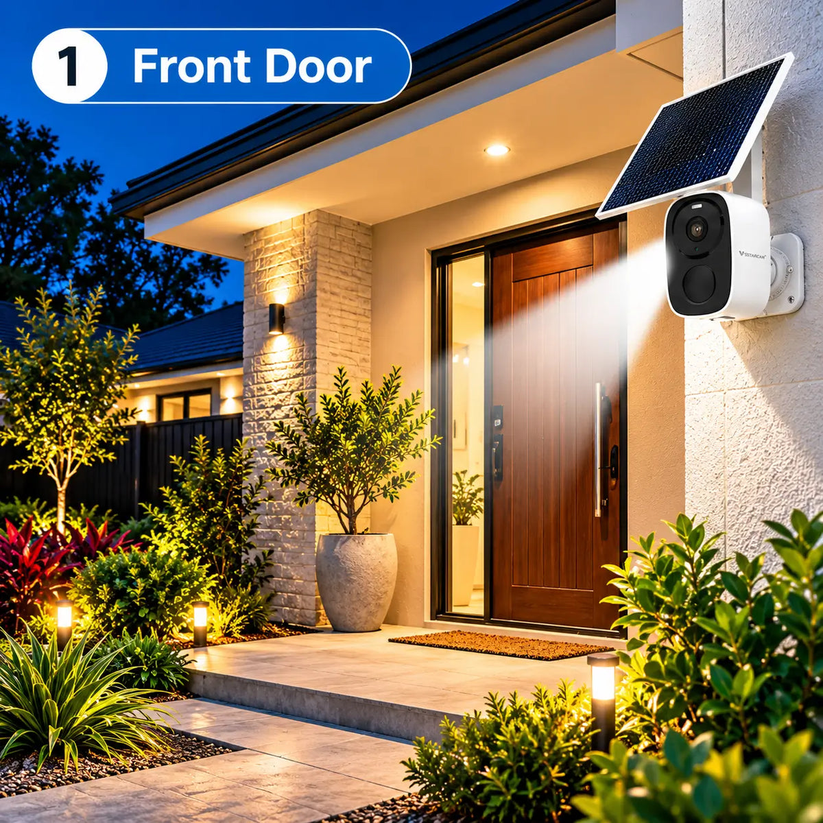 A Vstarcam BG55 solar powered wireless security camera wall-mounted at a modern home entrance, utilizing its built-in spotlight to illuminate a timber front door, entry mat, and garden landscaping at twilight.